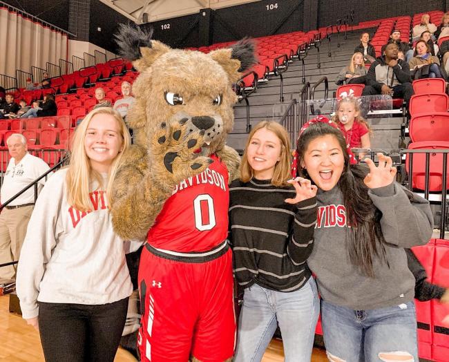 spirited  students pose with mascot
